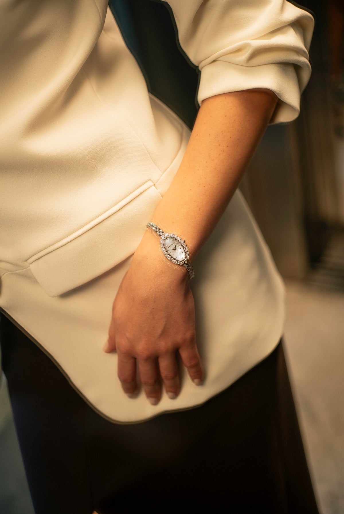 Silhouette, reference SI.01, worn with a cream jacket