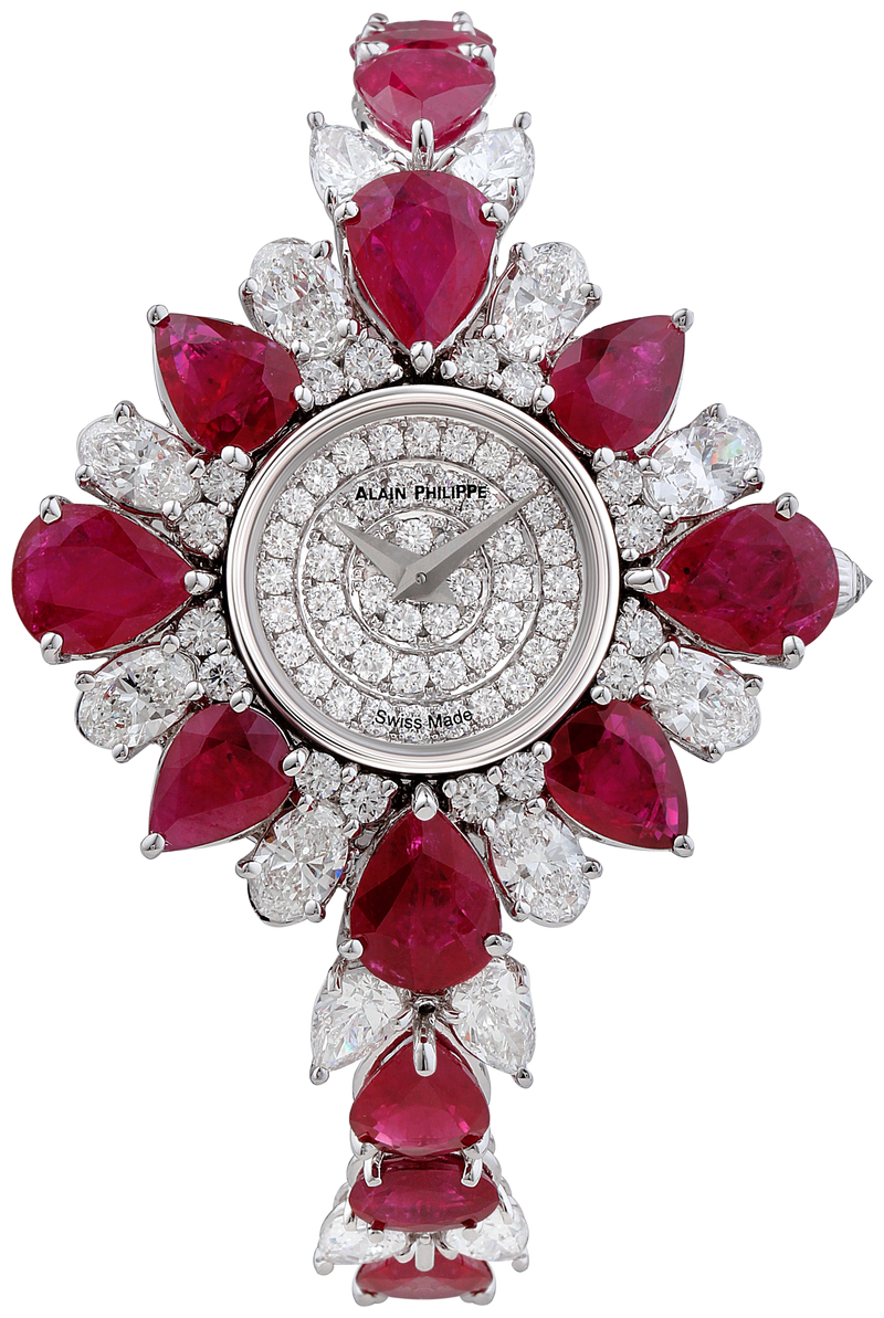 A round watch with a diamond dial, framed by a star of pear-cut rubies and pear-cut diamonds, continuing into a bracelet of the same stones