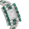 white diamond watch and emerald stones.